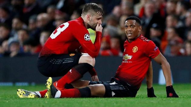 Manchester United's Anthony Martial after sustaining an injury, with Luke Shaw at Old Trafford on Feb 12. (Action Images via Reuters)