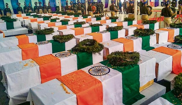 Tricolor draped coffins of the CRPF personnel, who lost their lives in Thursday's Pulwama terror attack, during wreath laying ceremony at the CRPF camp in Budgam.(PTI)