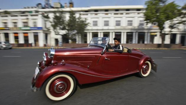 A vintage car make its way through a road during the 53rd Statesman Vintage Car Rally, in New Delhi. (Burhaan Kinu / HT Photo)