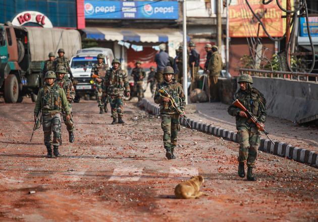 Army personnel patrol a street during a curfew, imposed after clashes between two communities over the protest against the Pulwama terror attack, in Jammu on Saturday. (HT PHOTO) Army personnel patrol a street during a curfew, imposed after clashes between two communities over the protest against the Pulwama terror attack, in Jammu on Saturday. (HT PHOTO)