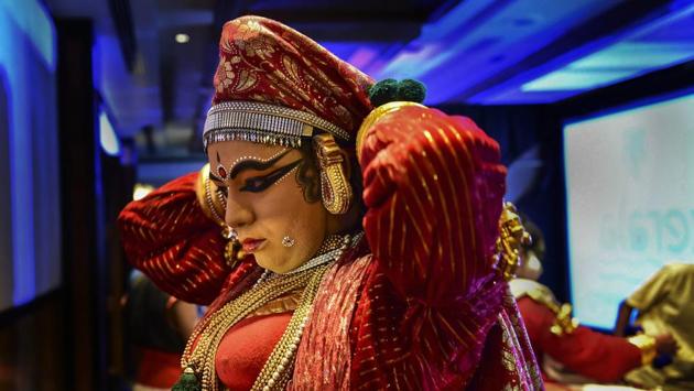 A Kathakali artist gets ready for a performance during a press conference of Kerala Tourism, in Bengaluru, Karnataka. (Shailendra Bhojak / PTI)