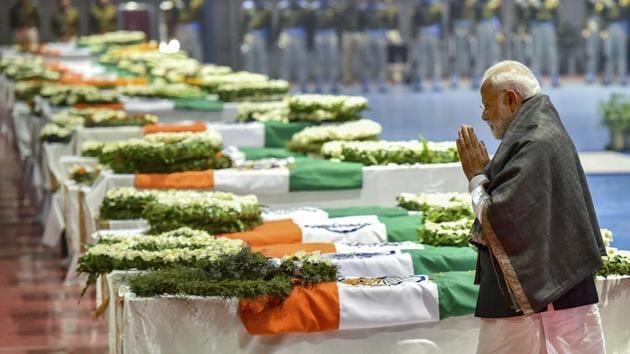 Prime Minister Narendra Modi pays tribute to the martyred CRPF jawans, who lost their lives in Thursday's Pulwama terror attack, after their mortal remains were brought at AFS Palam in New Delhi, Feb 15.(PTI)