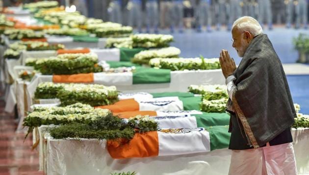 Prime Minister Narendra Modi pays tribute to the martyred CRPF jawans, who lost their lives in Thursday's Pulwama terror attack, after their mortal remains were brought at AFS Palam in New Delhi, Friday, Feb 15, 2019.(PTI photo)