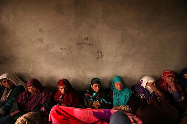 Adil Ahmad Dar’s sit inside his residence in Gundbagh village in south Kashmir's Pulwama district, February 15, 2019. Dar is accused of ramming an explosive-laden car into a CRPF convoy in Kashmir’s Pulwama on Feb 14, 2019.(Reuters)