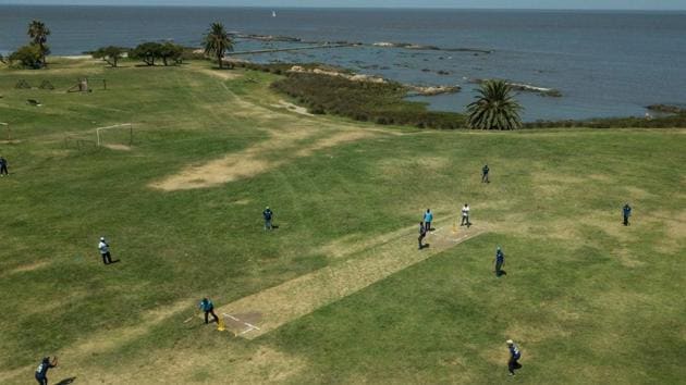 Aerial view of a cricket match played by Indians living in Uruguay, along Montevideo's seaside promenade, on February 10, 2019. (AFP) Aerial view of a cricket match played by Indians living in Uruguay, along Montevideo's seaside promenade, on February 10, 2019. (AFP)