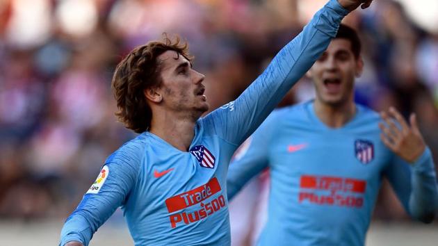 Atletico Madrid's French forward Antoine Griezmann celebrates after scoring a goal against Rayo Vallecano.(AFP)