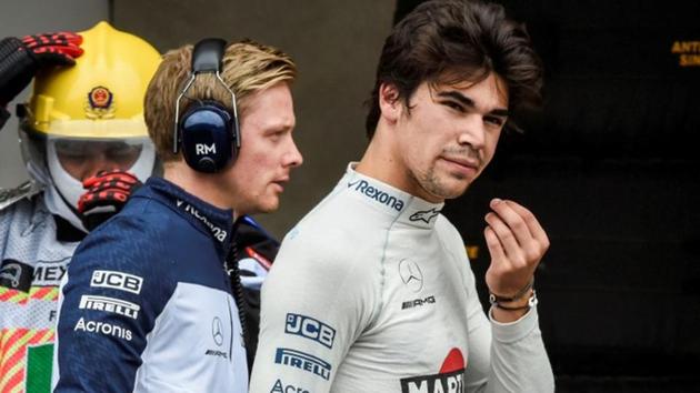 Williams' Canadian driver Lance Stroll walks in the pits.(REUTERS)