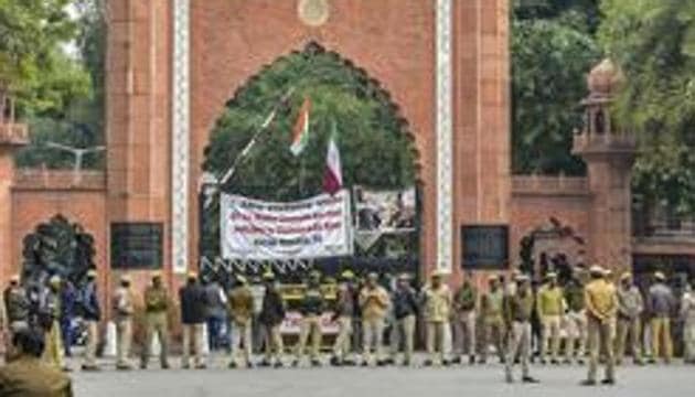 Police personnel deployed on the campus of Aligarh Muslim University in the view of protests after some students were booked on alleged sedition charges, in Aligarh on February 15.(PTI)