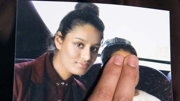 Renu Begum, sister of teenage British girl Shamima Begum, holds a photo of her sister as she makes an appeal for her to return home at Scotland Yard, in London.(REUTERS)