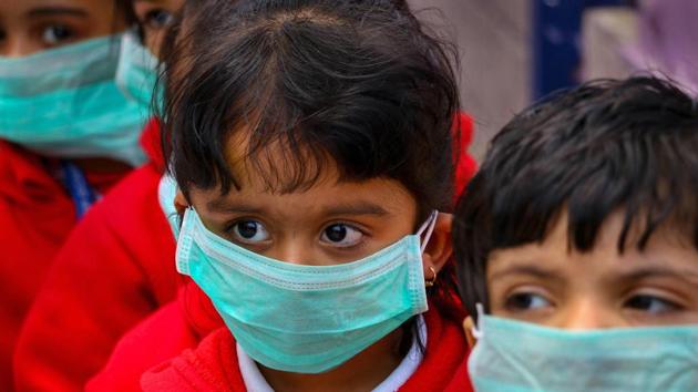 Students, wearing masks as protection against Swine Flu. (PTI) Students, wearing masks as protection against Swine Flu. (PTI)