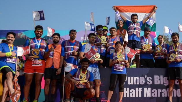 Winners of Pune’s biggest half marathon are seen with their medals and trophies.  (Milind Saurkar/HT Photo) 