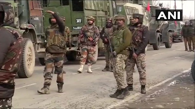 Soldiers take guard in Pingilana village after an encounter in Pulwama district of Jammu and Kashmir on Monday, days after a major attack in the district killed at least 40 CRPF personnel.(ANI/Twitter)