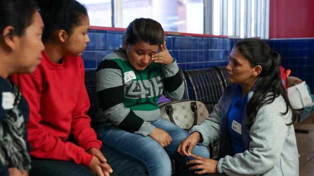 Orfa (R), a migrant from Honduras, comforts fellow migrant Karla as she cries following their release from ICE detention at a bus terminal in San Antonio, Texas, U.S. Orfa’s troubles in Honduras deepened when she separated from the children’s father, leaving her with no source of income and little chance of finding work. Eventually, she set out with her three children in early 2018 to make the approximately 2,700-mile (4,300-km) journey through Mexico to the United States. (Loren Elliott / REUTERS)