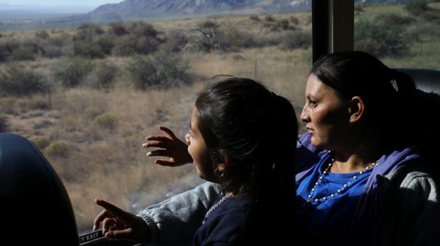 Orfa and her daughter Rachel look out of the window of a Greyhound bus during a leg of the journey from El Paso, Texas, U.S., to Portales, New Mexico, U.S. They joined one of the ‘caravans’ of thousands of Central American migrants that have made the trip over the past year in hopes of securing asylum in the United States. (Loren Elliott / REUTERS)
