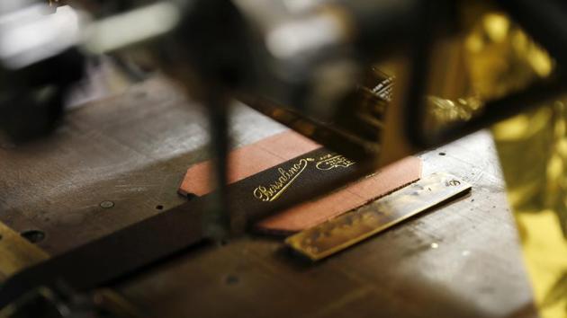 A view of a label of Borsalino at its hat factory. Borsalino’s new looks include corduroy baseball caps with the Borsalino logo prominently displayed, or felt travel hats that roll up neatly. (Antonio Calanni / AP Photo) A view of a label of Borsalino at its hat factory. Borsalino’s new looks include corduroy baseball caps with the Borsalino logo prominently displayed, or felt travel hats that roll up neatly. (Antonio Calanni / AP Photo)