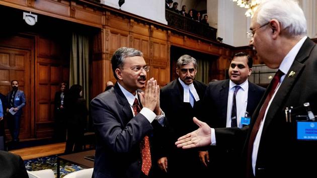 Secretary of Foreign Affairs of India Deepak Mittal (L) and Attorney General of Pakistan Anwar Mansoor Khan (R) greet each other at the International Court of Justice in The Hague, prior to the India-Pakistan case, on February 18, 2019. (AFP) Secretary of Foreign Affairs of India Deepak Mittal (L) and Attorney General of Pakistan Anwar Mansoor Khan (R) greet each other at the International Court of Justice in The Hague, prior to the India-Pakistan case, on February 18, 2019. (AFP)