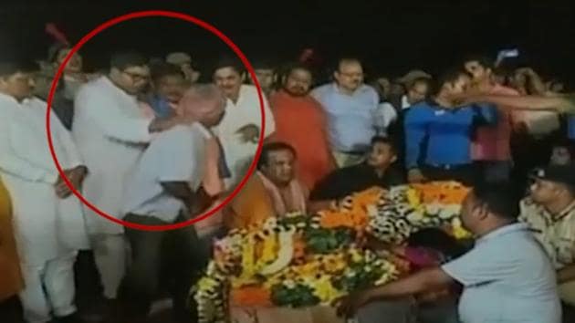 In the video, BJD MLA Debashis Samantaray was seen pushing and manhandling the CRPF jawan’s uncle, who fell down near the coffin. (Videograb) In the video, BJD MLA Debashis Samantaray was seen pushing and manhandling the CRPF jawan’s uncle, who fell down near the coffin. (Videograb)