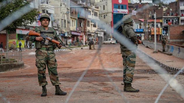 Army personnel stand guard at Gujjar Nagar area during a curfew, imposed on the third day after the clash between two communities over the protest against the Pulwama terror attack.(PTI)