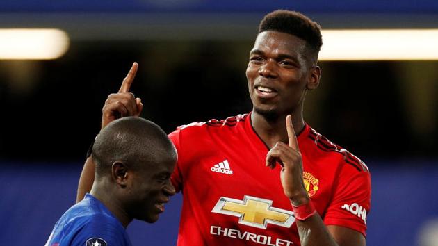 Manchester United's Paul Pogba gestures alongside with Chelsea's N'Golo Kante at the end of their FA Cup match.(Reuters)