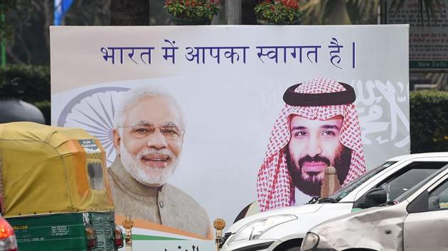 Vehicles drive past a billboard displaying the portrait of Indian Prime Minister Narendra Modi and Saudi Arabian Crown Prince Mohammed bin Salman ahead of his official visit to India, in New Delhi on February 19. (AFP Photo) Vehicles drive past a billboard displaying the portrait of Indian Prime Minister Narendra Modi and Saudi Arabian Crown Prince Mohammed bin Salman ahead of his official visit to India, in New Delhi on February 19. (AFP Photo)