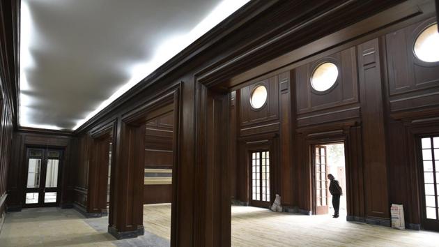 The gypsum partitions, walls and closures that covered most of the building’s original walls, grand doors, high ceilings and fireplaces have been removed. The conservation work includes reinforcing damaged roofs, and repairing and polishing the original doors, windows and the teakwood panelled walls. (Sanchit Khanna / HT Photo)