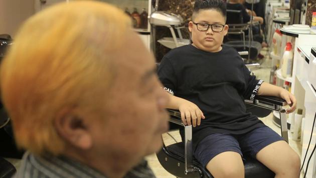 Over the past three days, barber Le Tuan Duong has made 200 Kim style haircuts, but only five for Trump. (AP) Over the past three days, barber Le Tuan Duong has made 200 Kim style haircuts, but only five for Trump. (AP)