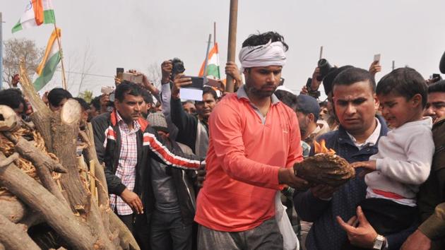 The funeral of Ajay Kumar, one of the four security personnel killed in an encounter in Pulwama on Feb 18, 2019, at his village, in Ghaziabad, on Tuesday, February 19, 2019.(Sakib Ali / HT Photo)