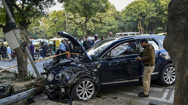 Police personnel investigate the accident site where a Bentley sedan car reportedly driven by industrialist Ponty Chadha's nephew rammed into an auto rickshaw, in New Delhi, Monday, Feb 18, 2019. (AP) Police personnel investigate the accident site where a Bentley sedan car reportedly driven by industrialist Ponty Chadha's nephew rammed into an auto rickshaw, in New Delhi, Monday, Feb 18, 2019. (AP)