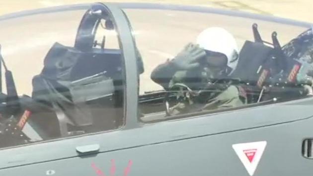 Army chief General Bipin Rawat waives at the crowd before taking off in light combat aircraft Tejas at the Aero India 2019 show in Bengaluru on Thursday.(ANI)