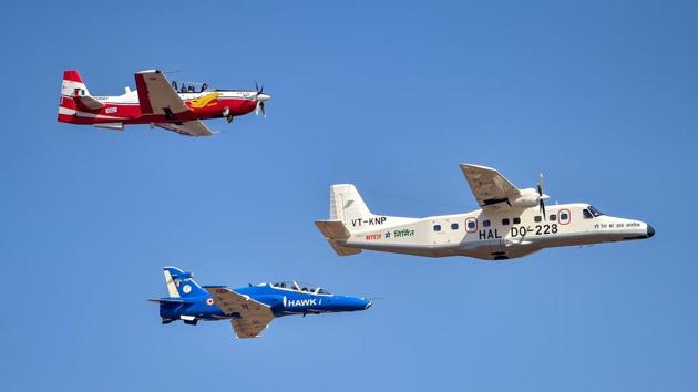 IAF's Dornier aircraft (R), flanked by HTT-40 and Hawk, manoeuvres during the show. The IAF decided not to fly its Surya Kiran jets at the air show after it lost two of its nine aircrafts on Tuesday. (Shailendra Bhojak / PTI)