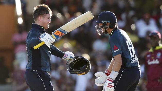 England's Jason Roy, left, celebrates with Joe Root scoring a century against West Indies during the first One Day International cricket match at the Kensington Oval in Bridgetown(AP)