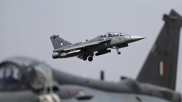 India’s Light Combat Aircraft (LCA) Tejas has received the final operational clearance (FOC) from military aviation regulator Cemilac for induction into the Indian Air Force (IAF) as a weaponised fighter jet. The Chief Executive of Centre for Military Airworthiness and Certification (Cemilac), P Jayapal, handed over the FOC certificate and release-to-service documents to Chief of Air Staff Air Marshal BS Dhanoa at the Aero India air show in Bengaluru. (Aijaz Rahi / AP)
