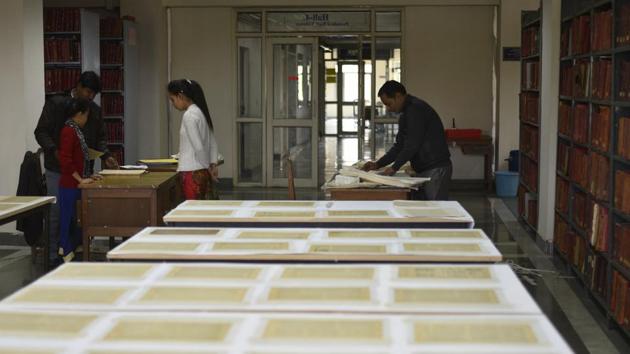 Jamia has a collection of around 2,500 rare books and manuscripts of which 2,230 have been digitised under this project. The project was started in February last year. The books were first conserved using tissue lamination as per the norms of National Archives of India. As the pages of these books were extremely brittle, they were bound before digitisation. (Burhaan Kinu / HT Photo)
