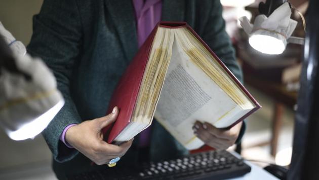 “We generally use scanners for the digitisation of old books and manuscripts. But, here, we used DSLR cameras instead. Though we could not capture the images as per standards of scanners, it cost us much less,” said Naseem Hasan of Noor International Microfilm Centre situated at Iran Culture House. (Burhaan Kinu / HT Photo)