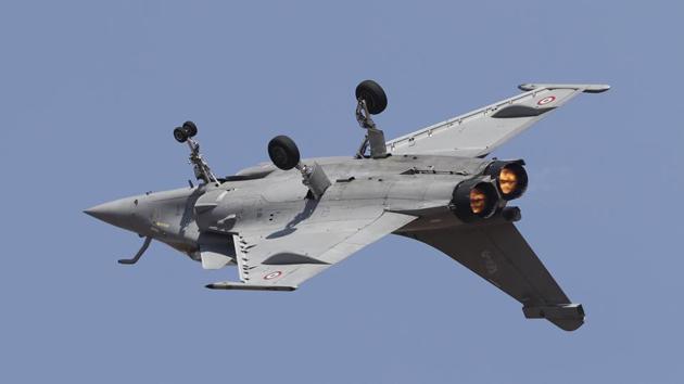 The political row-hit Rafale jet was the cynosure of all eyes as the breathtaking display of manoeuvres by the military aircraft and aerobatic team cast a spell on the 12th edition of Aero India. Three Rafale jets have arrived in Bengaluru for the show -- two for flying and one on static display. A Rafale aircraft also flew lower than its normal speed as a mark of respect to Wing Commander Sahil Gandhi. (Aijaz Rahi / AP)