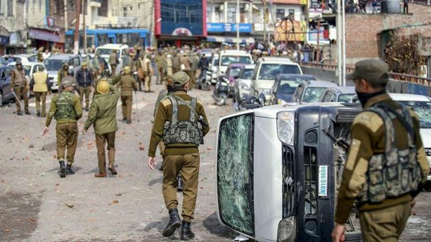Jammu: Security personnel patrol a street after vehicles were set on fire by protestors against the killing of CRPF personnel in the Pulwama terror attack(PTI) Jammu: Security personnel patrol a street after vehicles were set on fire by protestors against the killing of CRPF personnel in the Pulwama terror attack(PTI)