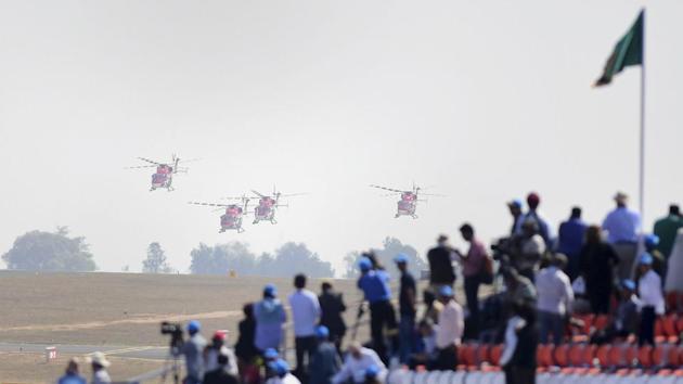 Delegates watch aircrafts at the show. The show will last till February 24. (Shailendra Bhojak / PTI)