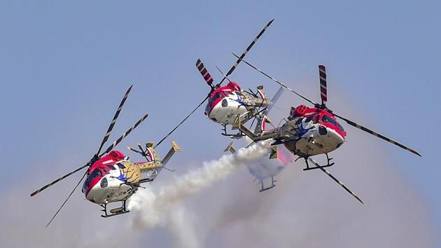 Indigenously manufactured Indian Air Force (IAF) Dhruv helicopters fly in a formation. The display included the state-run Hindustan Aeronautics Ltd.’s (HAL) Advanced Light Helicopter (ALH), Light Combat Helicopter (LCH) and Light Utility Helicopter (LUH). (Shailendra Bhojak / PTI)