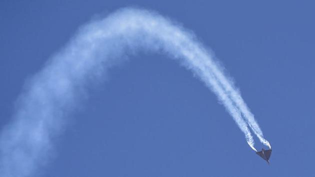 The Light Combat Aircraft (LCA) Tejas manoeuvres during the inaugural day of the show. The aircraft also paid tribute to former Prime Minister Atal Bihari Vajpayee, who gave it its name. (Shailendra Bhojak / PTI)