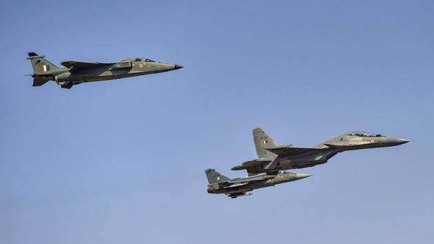 Indian Air Force’s Sukhoi aircraft, flanked by a Jaguar and an LCA Tejas formed the ‘missing man’ formation (which leaves space for one aircraft) on the inaugural day of Aero India 2019, as a tribute to Wing Commander Sahil Gandhi, who lost his life in a mid-air collision during rehearsals in a Surya Kiran Acrobatics Team aircraft on Tuesday. The show kicked off at Yelahanka airbase in Bengaluru on Wednesday. (Shailendra Bhojak / PTI)