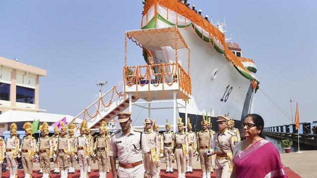 Defence Minister Nirmala Sitharaman inspects a guard of honour during the launch of a Coast Guard offshore patrol vessel (OPV) of the Goa Shipyard Limited, in Vasco town of Goa. Sitharaman cautioned Indian defence shipyards against constantly pleading with the government for equipment manufacturing contracts while urging them to look abroad for selling maritime battle ware. (PTI)