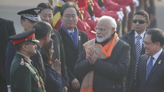 Prime Minister Narendra Modi, center, greets upon his arrival as South Korean Minister of Science and ICT You Young Min, right, looks at the Seoul airport in Seongnam, South Korea, Thursday, Feb. 21, 2019.(AP)