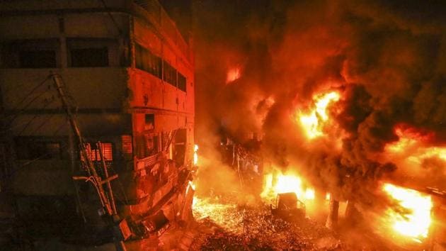 Flames rise fire from a fire in a densely packed shopping area in Dhaka, Bangladesh, Thursday, February 21, 2019.(AP)