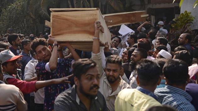 People carry coffins of relatives out from a morgue. The contrast between new and old Dhaka - the city’s north and south sides - is stark, said Shafiq-Ur Rahman, an urban planning professor at Jahangirnagar University in Dhaka. “As the area was developed continuously, there is very high population density and haphazard growth,” he said. (Mahmud Hossain Opu / AP)