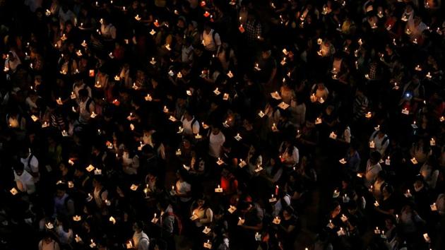 College students hold candles during a vigil to pay tribute to Central Reserve Police Force (CRPF) personnel who were killed after a suicide bomber rammed a car into the bus carrying them in Kashmir, in Kolkata, West Bengal. (Rupak De Chowdhuri / REUTERS) College students hold candles during a vigil to pay tribute to Central Reserve Police Force (CRPF) personnel who were killed after a suicide bomber rammed a car into the bus carrying them in Kashmir, in Kolkata, West Bengal. (Rupak De Chowdhuri / REUTERS)