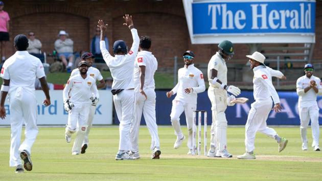 Sri Lanka's team players celebrate taking Kagiso Rabada's (3rd R) wicket during the second day of their Test match. (AFP) Sri Lanka's team players celebrate taking Kagiso Rabada's (3rd R) wicket during the second day of their Test match. (AFP)