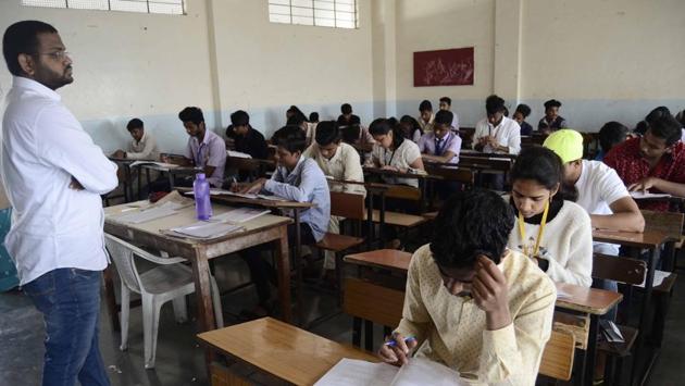 An invigilator is seen in the block as HSC exams commence in the state. (Ravindra Joshi/HT PHOTO) 