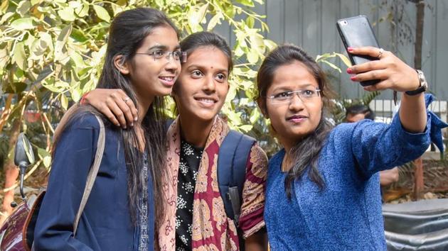 Students seen celebrating completion of the first paper by clicking a selfie. (Sanket Wankhade/HT PHOTO) 
