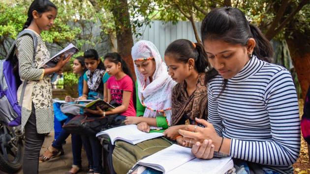 Students spotted outside the examination centre, revising for the examination.  (Sanket Wankhade/HT PHOTO) 