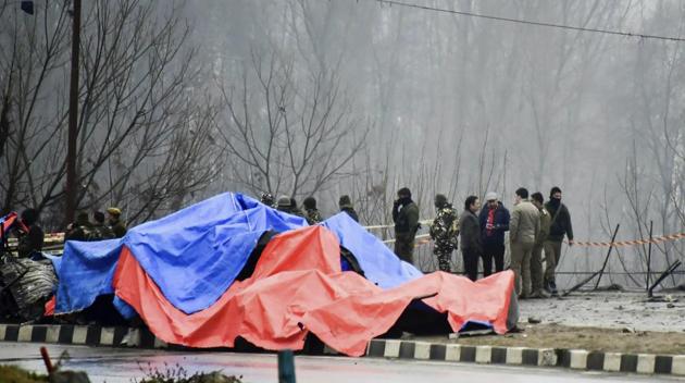 Lethpora: Security agencies inspect the site of suicide bomb attack at Lethpora area, in Pulwama district of south Kashmir, Friday, Feb. 15, 2019. At least 37 CRPF personnel were killed yesterday in one of the deadliest terror attacks in Jammu and Kashmir when a Jaish suicide bomber rammed a vehicle carrying over 100 kg of explosives into their bus in Pulwama district. (PTI Photo/S Irfan)(PTI2_15_2019_000037B) (AP) Lethpora: Security agencies inspect the site of suicide bomb attack at Lethpora area, in Pulwama district of south Kashmir, Friday, Feb. 15, 2019. At least 37 CRPF personnel were killed yesterday in one of the deadliest terror attacks in Jammu and Kashmir when a Jaish suicide bomber rammed a vehicle carrying over 100 kg of explosives into their bus in Pulwama district. (PTI Photo/S Irfan)(PTI2_15_2019_000037B) (AP)